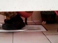 Ukraine soldier pooping in squat toilet