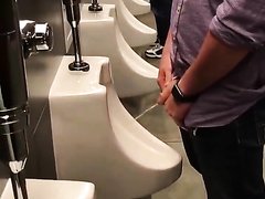 hot boy peeing at the urinal 34