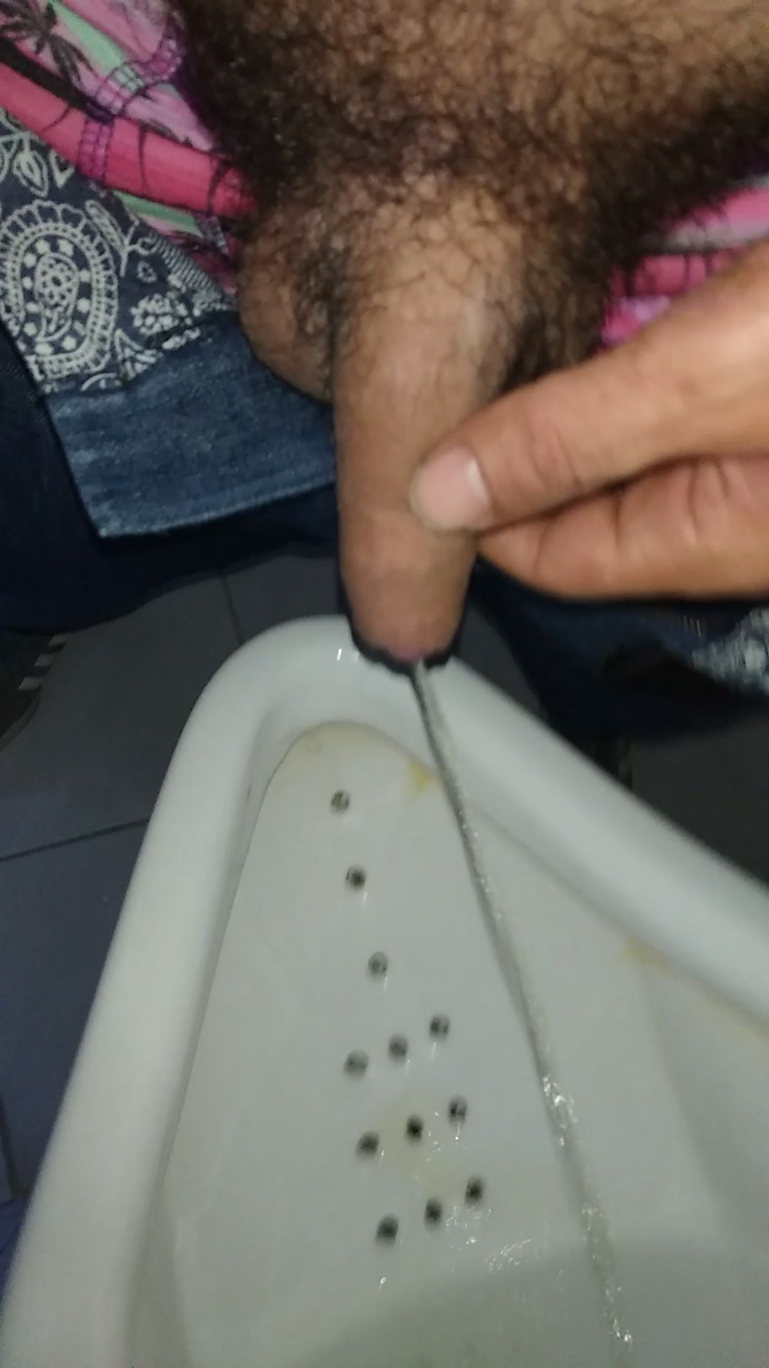 Pissing in public restroom