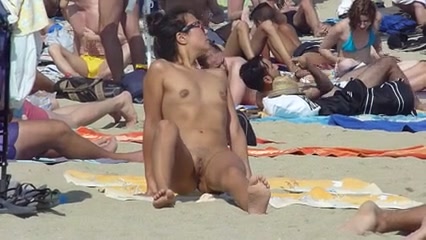 Sexy babe tanning nude at the beach - public porn at ThisVid tube
