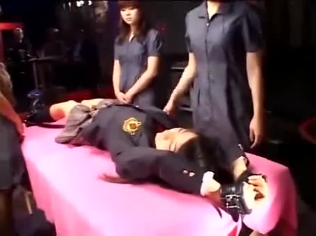 Asian mistresses play with a helpless girl