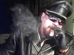 Leather Daddy Smokes a cigar