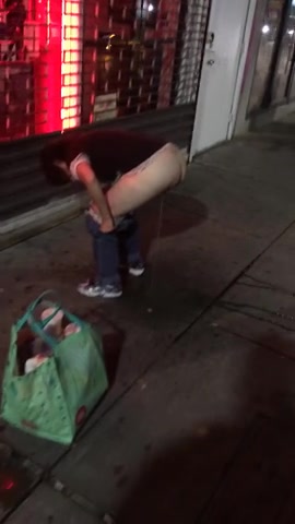 Kinky bitch enjoys peeing hard in the middle of the sidewalk