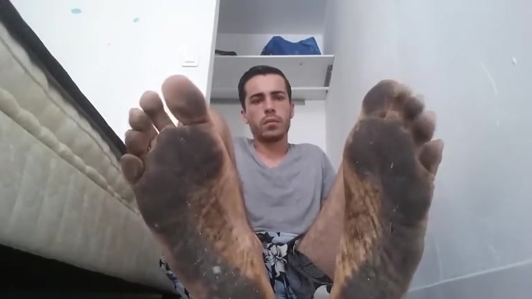 Hot guy with filthy feet sucking on his toes