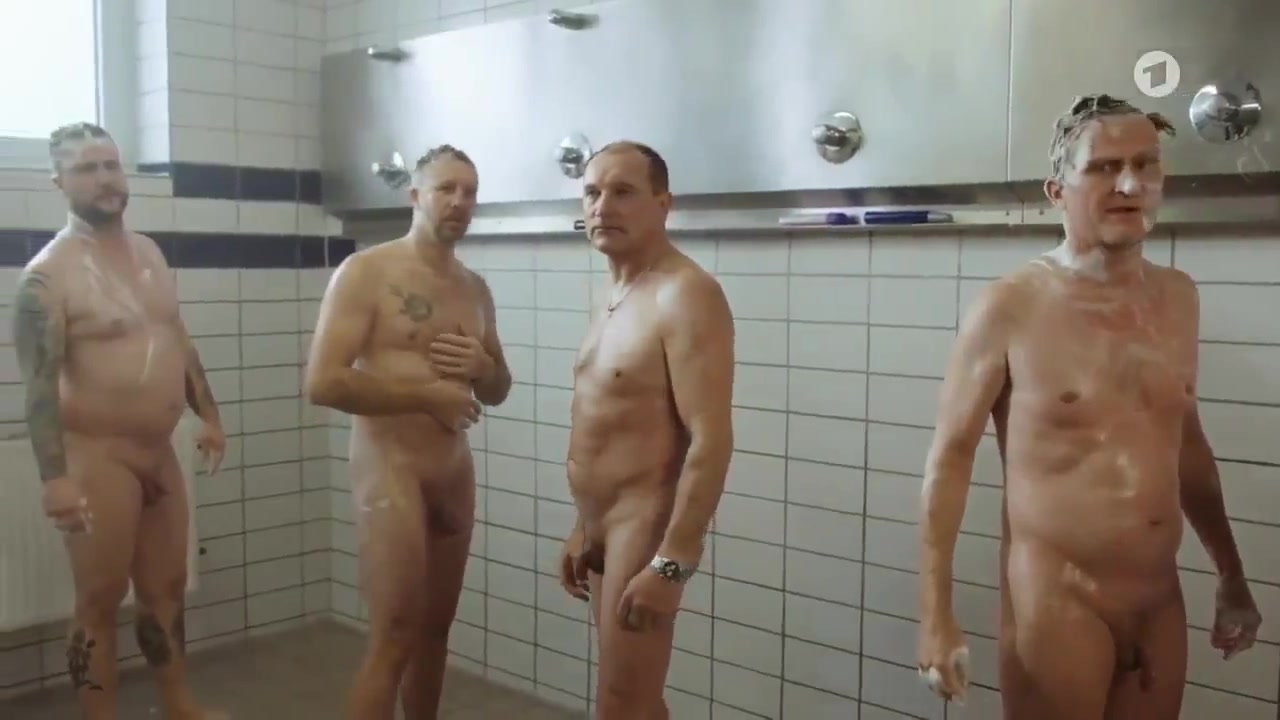 Naked men taking a shower