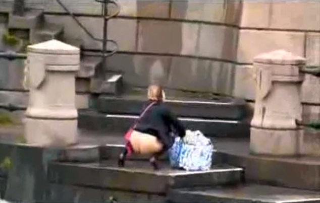 Crazy mature woman caught peeing on the stone stairs