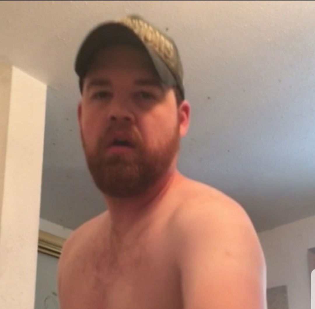 Str8 redneck with ginger beard shows off in bathroom