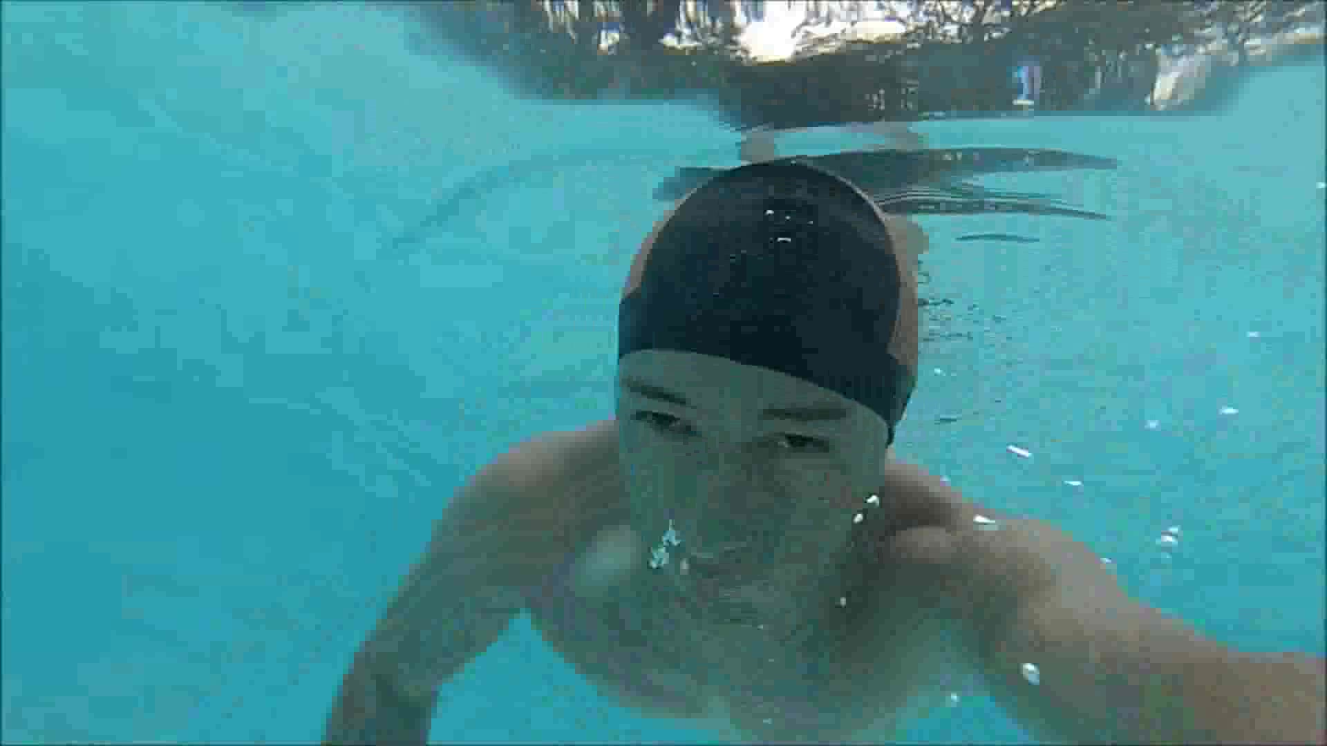 Swimcap latino underwater in bulging speedo