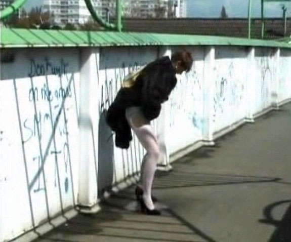 Mature lady pees on the street without taking off the panties