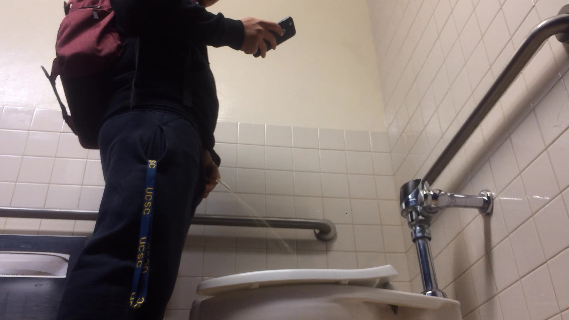 student pissing & texting
