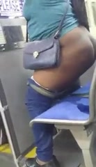 Thick Ebony pissing on a bus seat