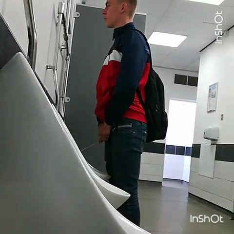 Ginger dude takes a quick piss