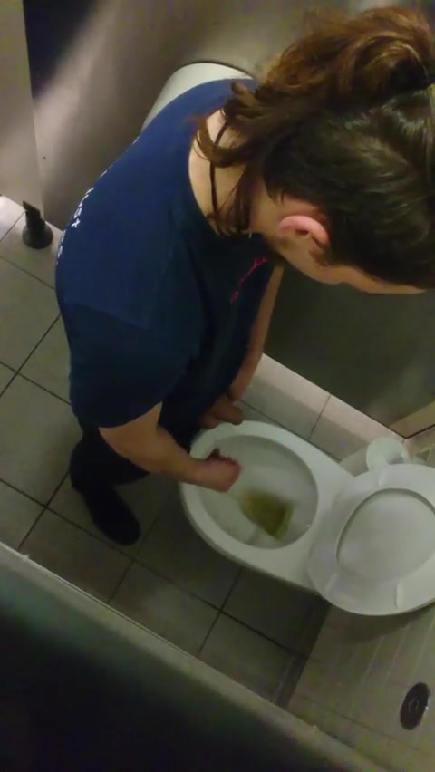 Young man pissing