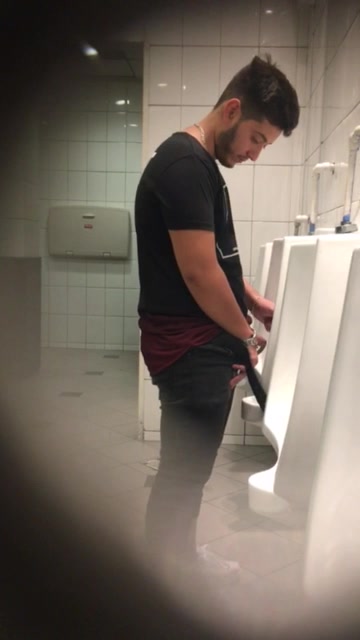 Young man pissing - video 2