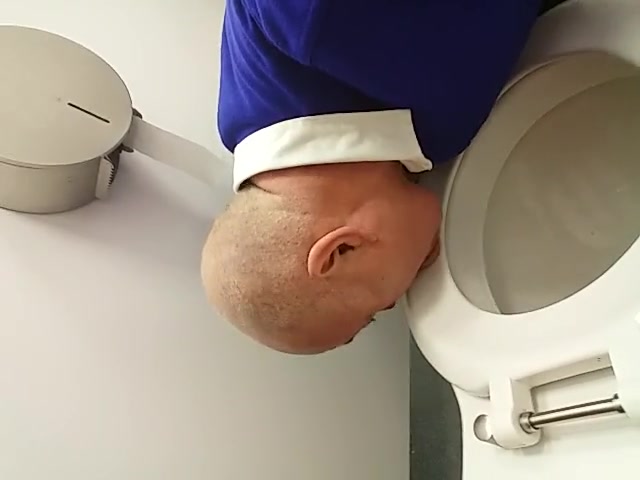 Faggot plays with toilet