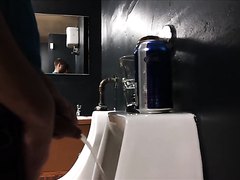 Uncut young guy pissing in a club