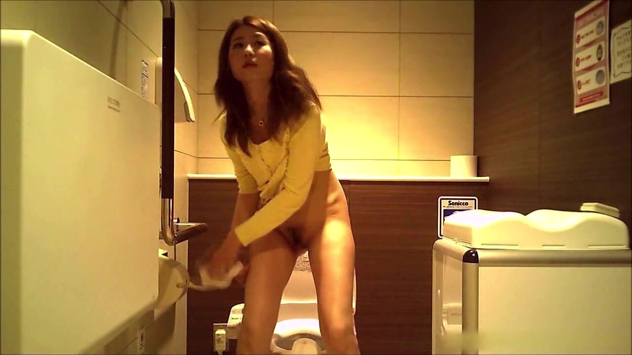 Cute Asian girl peeing on hidden photo