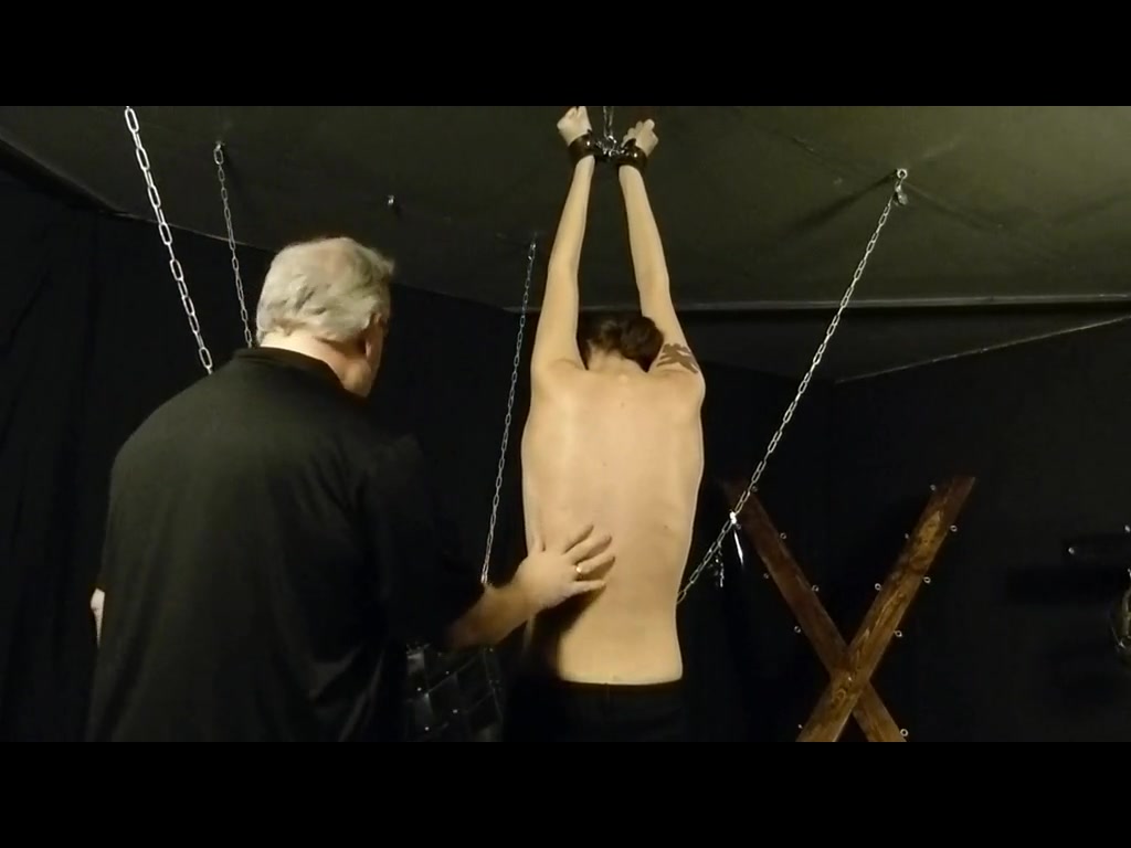 the boy who was in stocks is now strung up in in underware and whipped per