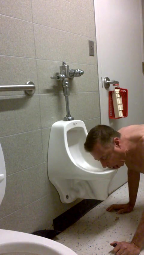 Faggot licks urinal