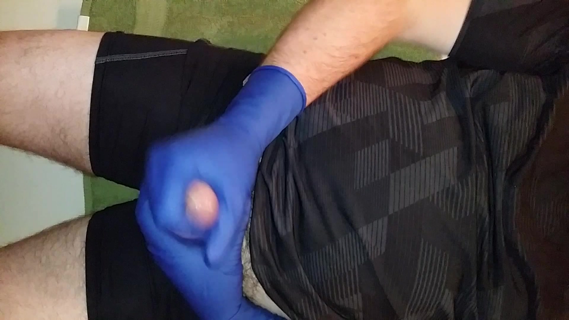 Stroking in Blue Biogel Surgical Gloves