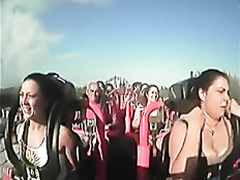 Big boobs pop out on roller coaster ride
