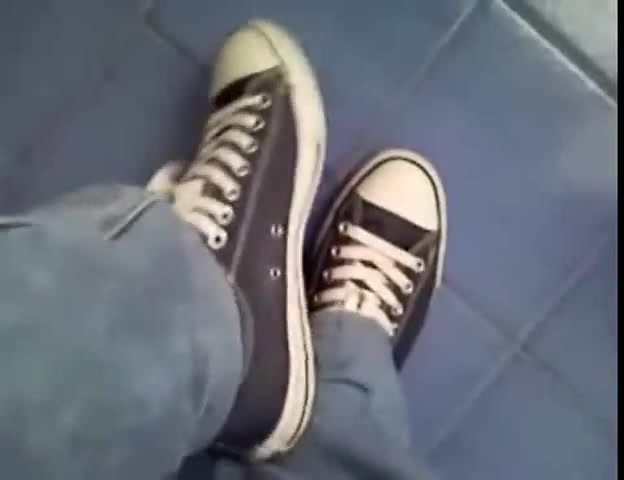 someone playing with his converse