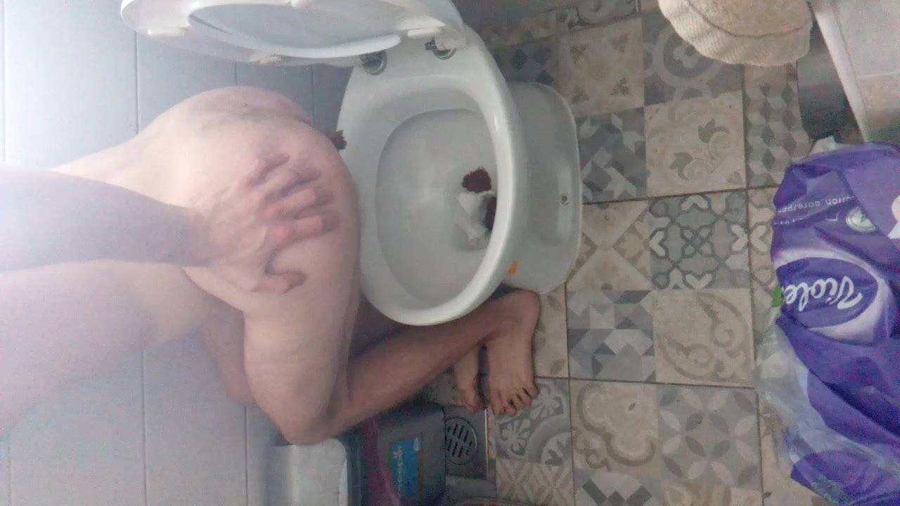 Teen boy shitting in toilet