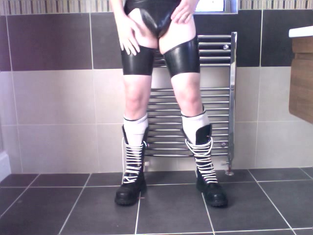German-Twink-Pisses-and-Wanks-in-Rubber-Gear