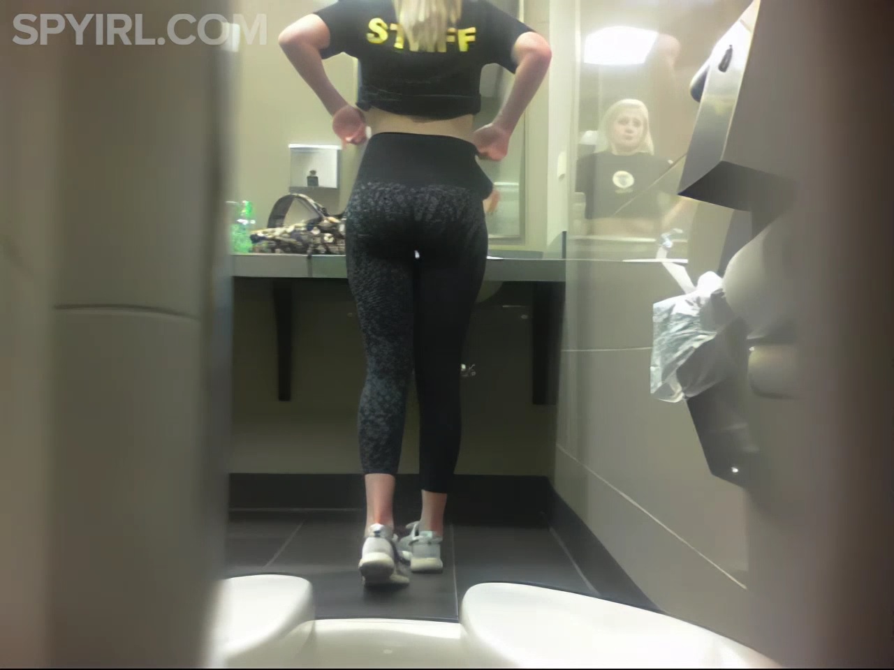 Blonde gym babe in leggings pisses in public toilet photo