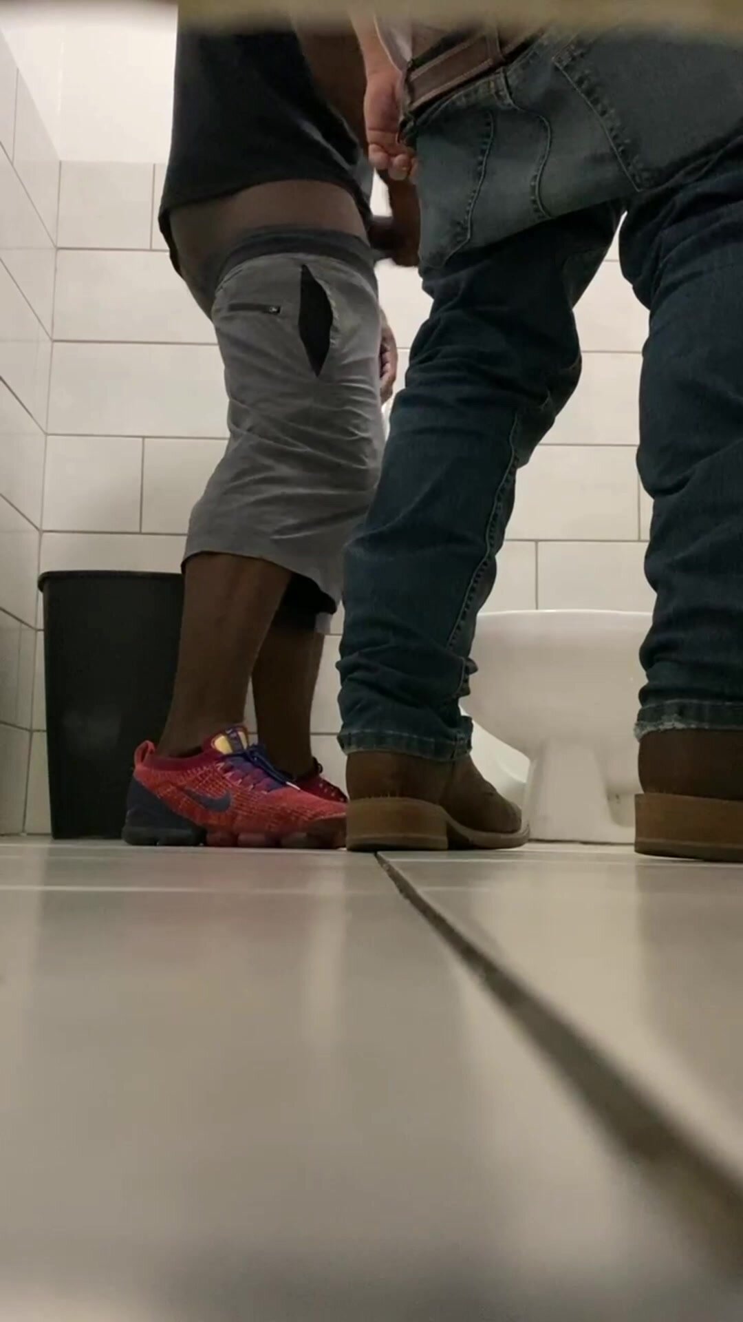 Caught two guys having fun in stall picture pic