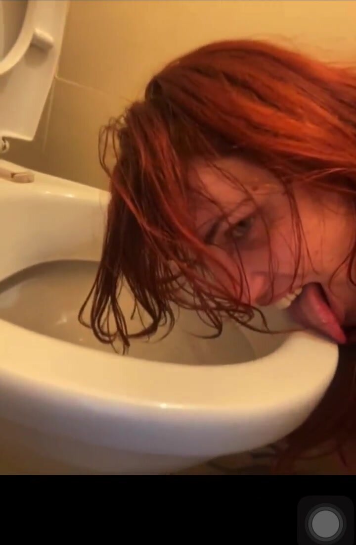 Slut Licks Pee from the Floor in a Public Toilet photo