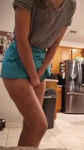 Flip Skirt Asian Porn - Cute girl holds and wets in skirt - ThisVid.com
