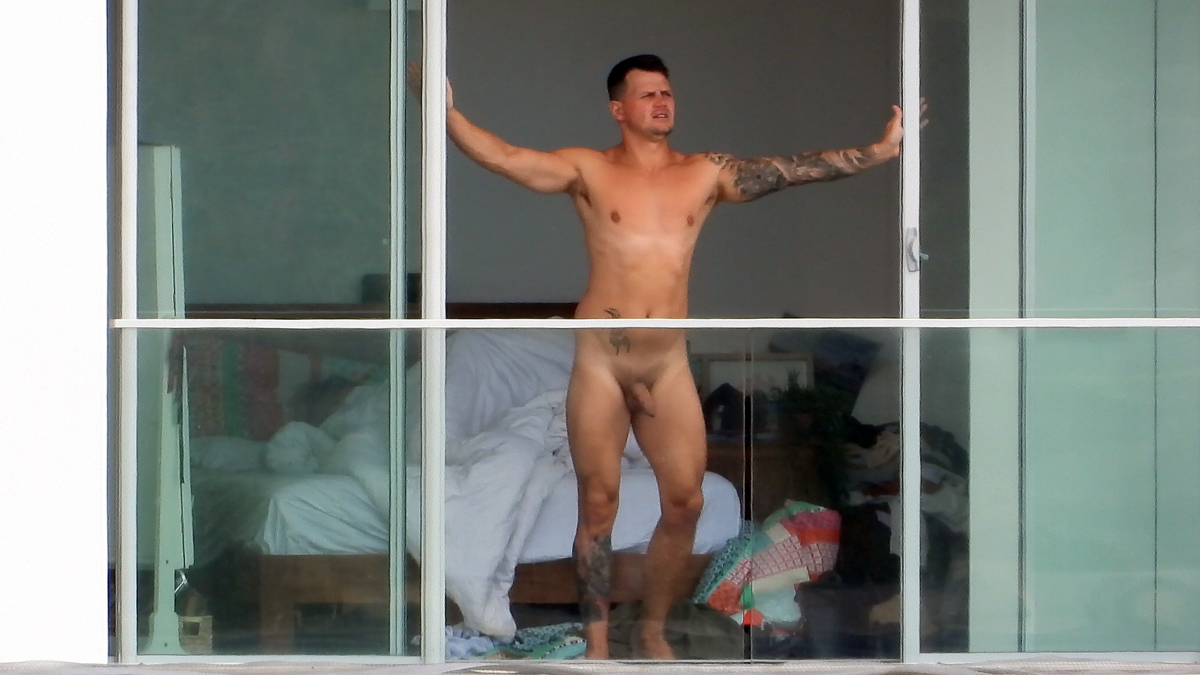 man naked voyeur window