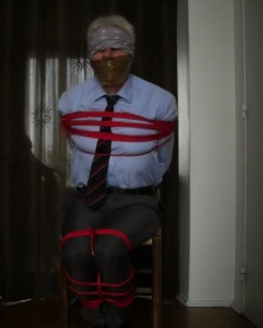 Bound, gagged, blindfolded in suit