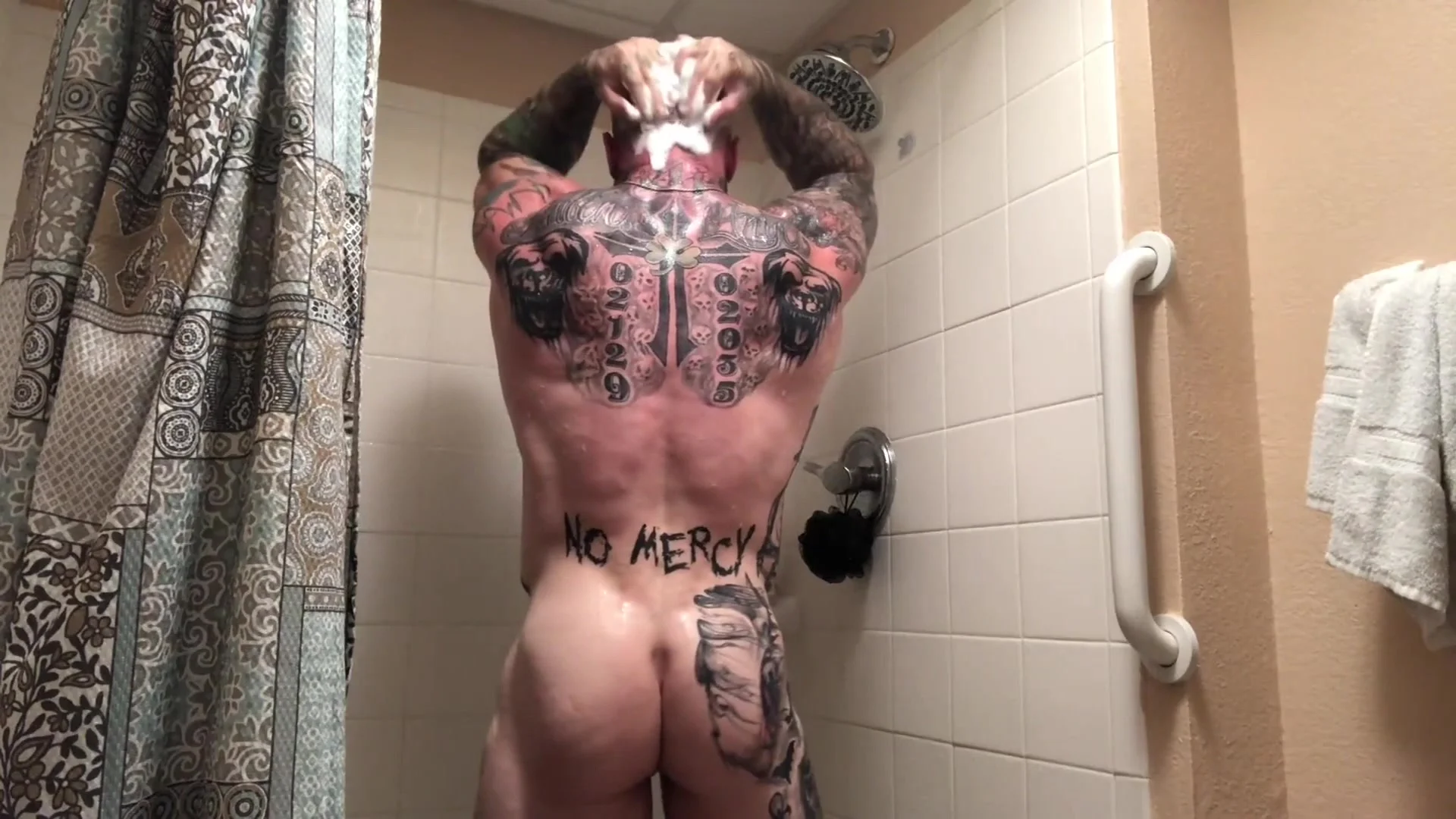 Shower Tattoo - Beefy tattooed muscle bodybuilder takes a shower and cum ...