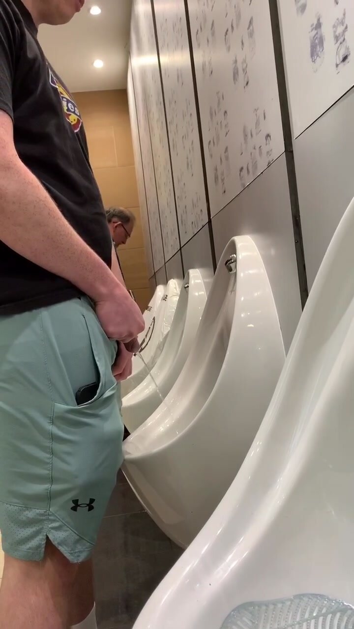 Athletic lad taking a piss