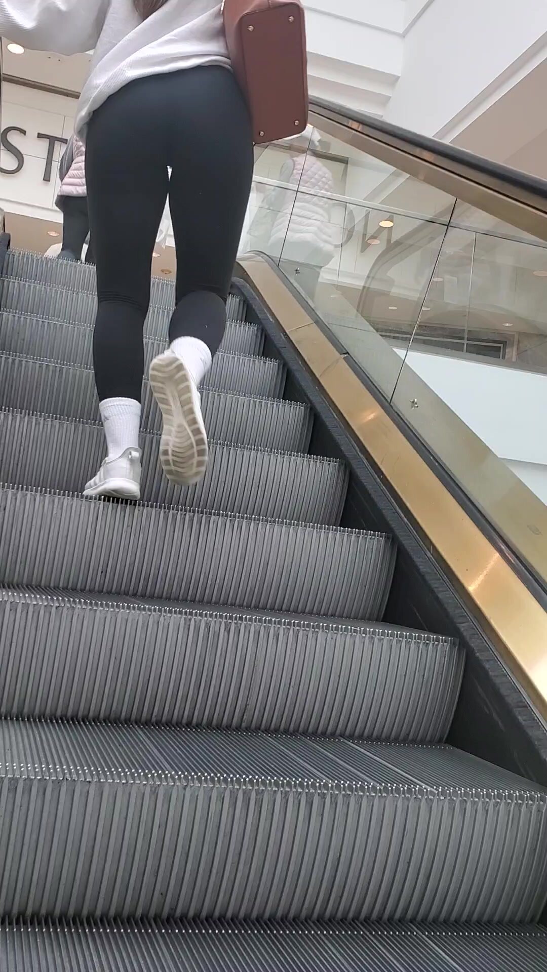 leggings on escalator voyeur