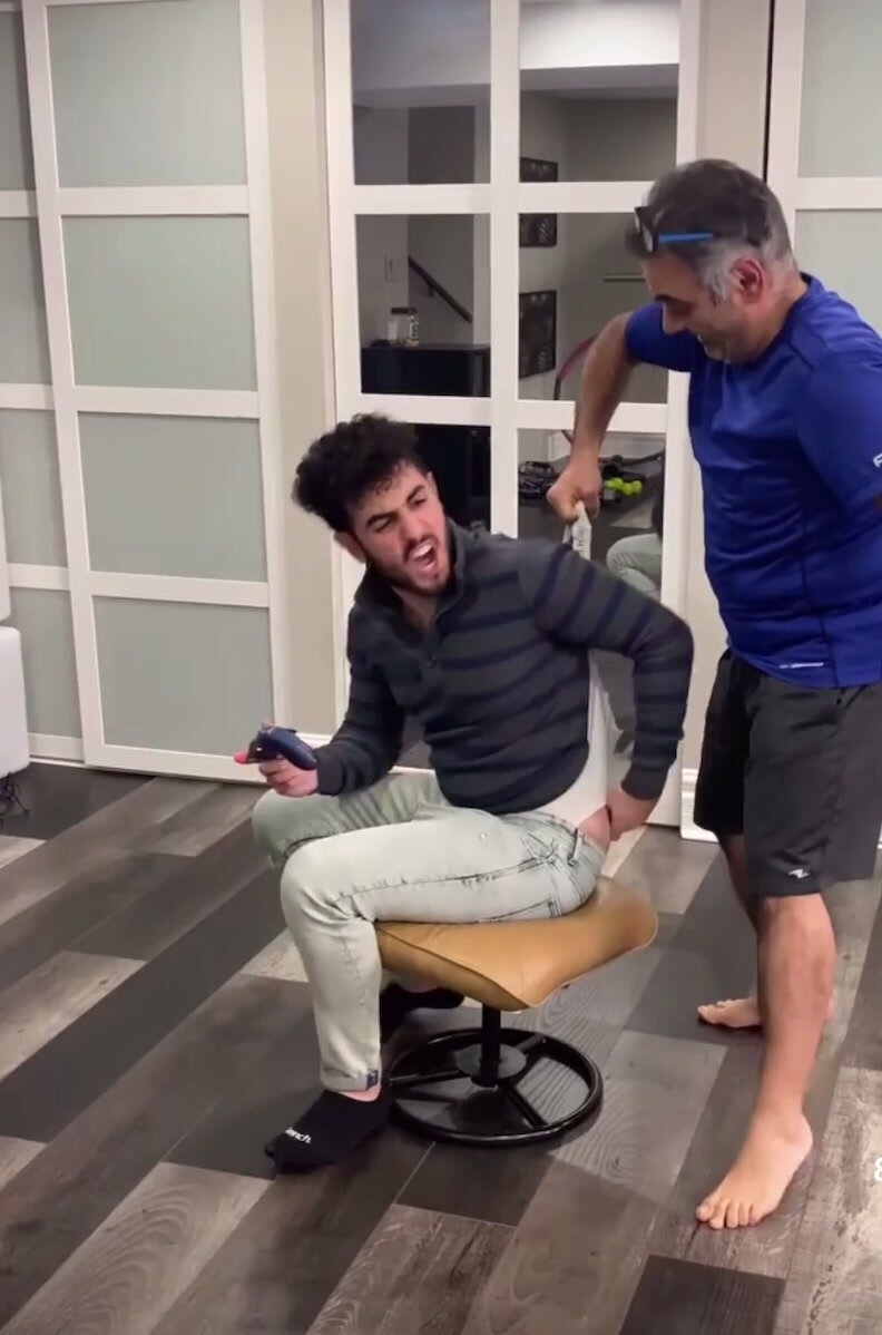 Dad gives older son a wedgie - ThisVid.com