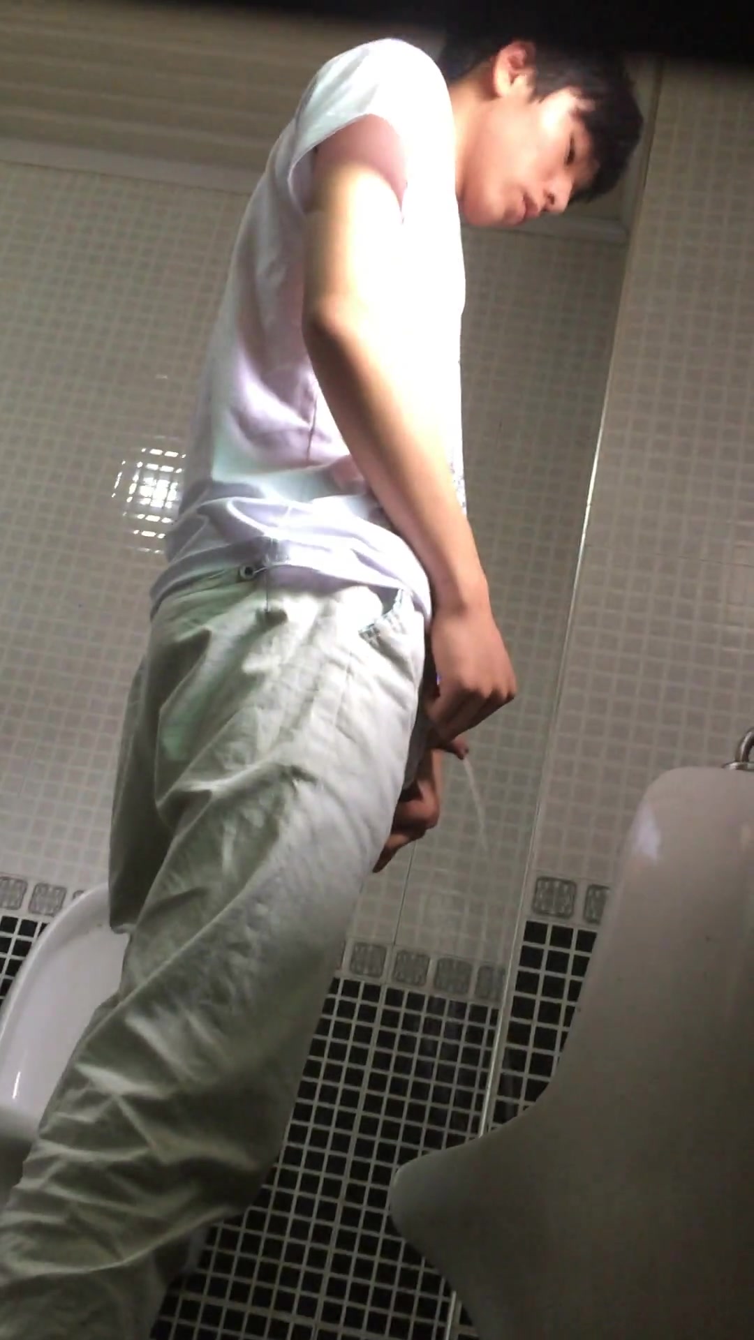 ASIAN BOY PISSING IN THE TOILET picture