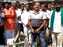 INDIAN MEN PISSING ON FLAG