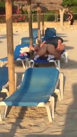 Amateur couple having sex on the beach