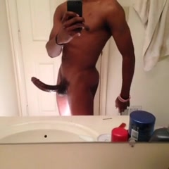 Black guy playing with his dick