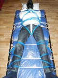 Hogtied and straitjacketed