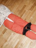Prisoner in a straitjacket