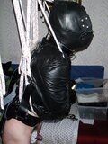 Suspended in a leather straitjacket