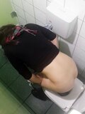 Girl peeing in toilet