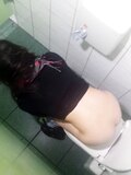 Girl peeing in toilet