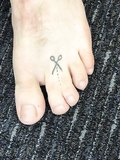 Webbed Toes and Tattoos