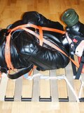 Straitjacketed and restrained.