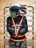 Straitjacketed and restrained.
